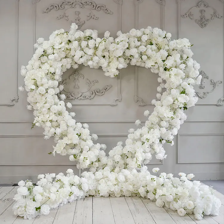 Cloud 9 — A cream heart arch in dense blooms — the softest, most forgiving light of anything we build