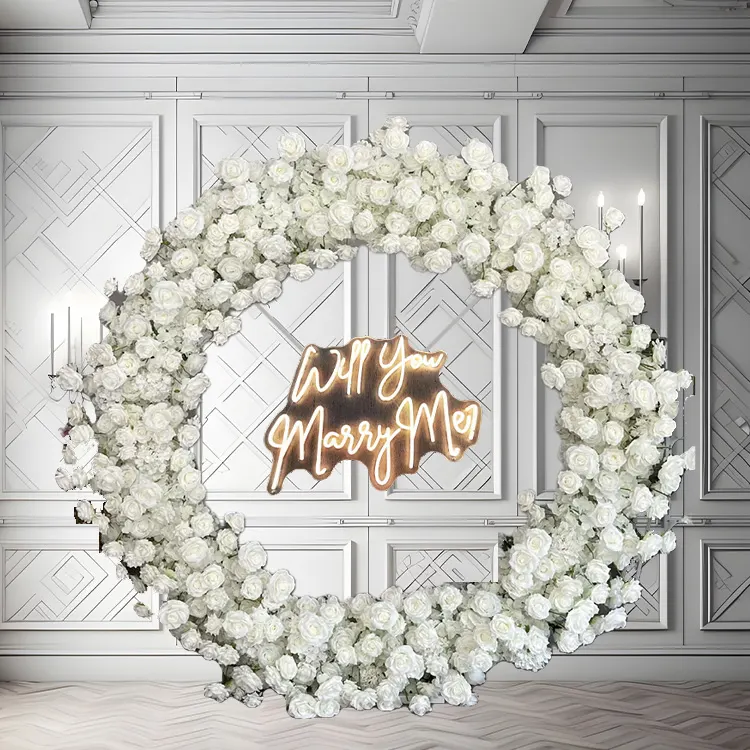 Halo — A white circle arch finished with a Marry Me sign at its centre — the question, framed literally